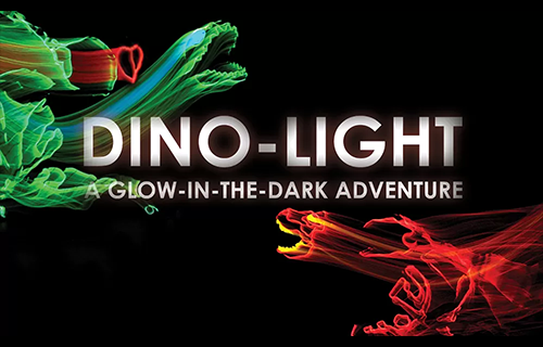 Promotional graphic reading ‘DINO-LIGHT: A Glow-in-the-Dark Adventure,’ featuring neon-style dinosaur outlines in green and red against a black background.